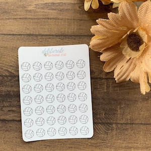 May include: A sheet of white sticker paper with 49 black and white volleyball stickers. The stickers are arranged in 7 rows of 7 stickers each. The sticker sheet has the text "deliberate goods co." printed in the top left corner.