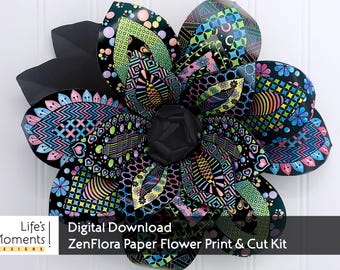 May include: A large, decorative paper flower with black petals and a black center. The petals are adorned with colorful geometric patterns in shades of pink, blue, green, and yellow. The text "Life's Moments Designs" and "Digital Download ZenFlora Paper Flower Print & Cut Kit" are visible.