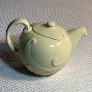 Vintage Coorsite Art Deco teapot with lid in pale yellow.