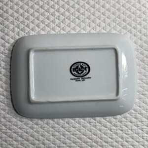 May include: White rectangular dish with rounded corners. The base features a black circular logo with text: "CORDON BLEU MADE IN CHINA Microwave Dishwasher Oven Safe."