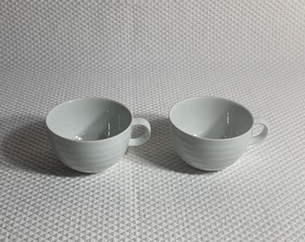 Set of 2 Crate & Barrel white porcelain 10 ounce coffee mugs or tea cups.