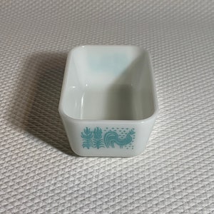 Pyrex turquoise 502 milkglass fridgie in the Amish Butterprint design.