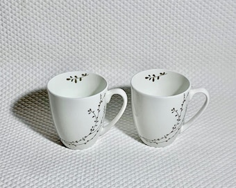 Set of 2 Roscher, Bone China white tea cups with silver branches.