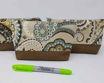 Square bottom zipper accessory bag with a  Bohemium flair.