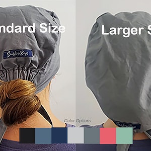 May include: Two gray scrub hats, one labeled "Standard Size" and the other "Larger Size". The hats are shown from the back, with the ties hanging down. A color chart shows 10 different color options for the hats.