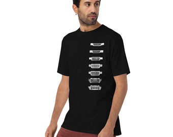 May include: A black t-shirt with a white graphic of a series of different car grilles. The grilles are arranged vertically in a row, starting with the largest at the top and getting progressively smaller towards the bottom.