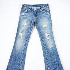 INGNI Low Rise Ripped Flare Jeans