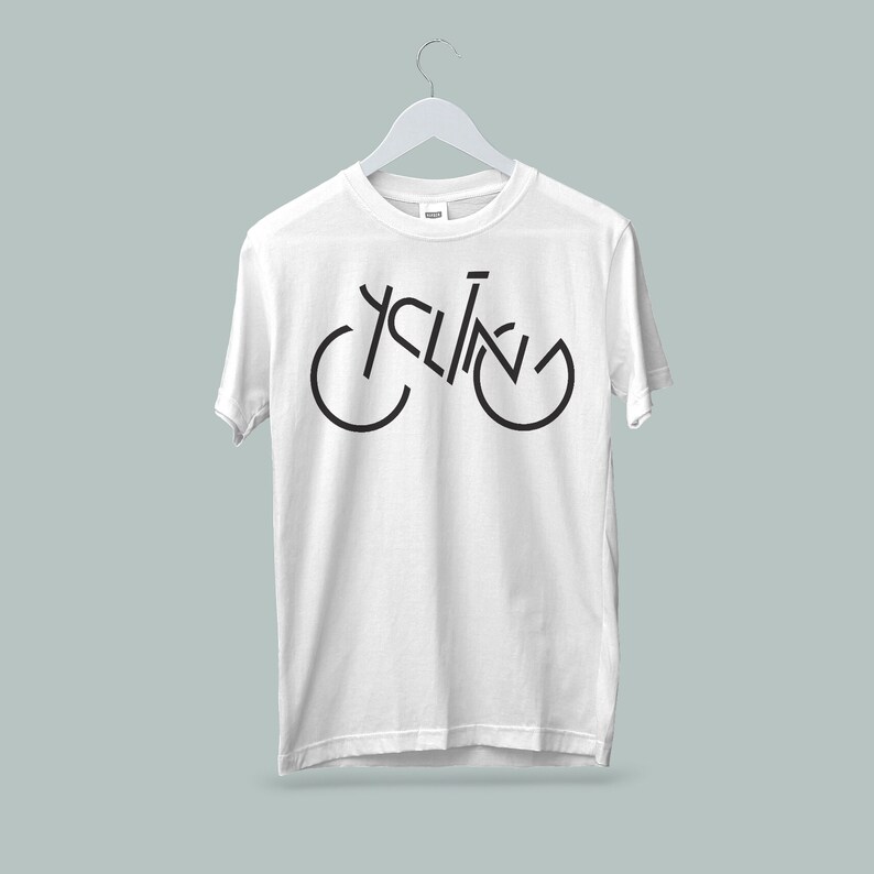 May include: White t-shirt with a black graphic of a bicycle with the word "cycling" incorporated into the design.