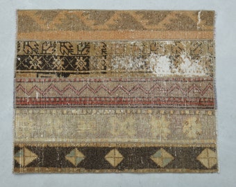 May include: A multi-coloured patchwork rug with a geometric pattern. The rug is made of different fabrics and has a distressed look.