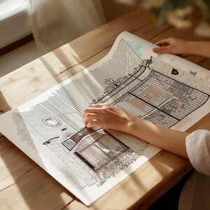 May include: A black and white line drawing of a building with a gate. The drawing is on a white sheet of paper and is being held by a person's hands.