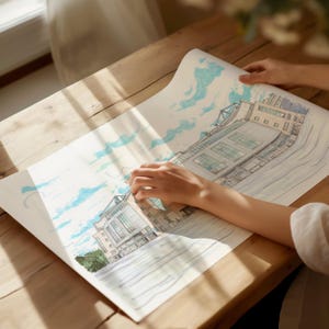May include: A hand traces the outline of a detailed drawing of a building with a blue sky and clouds in the background.