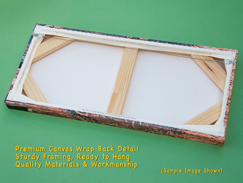 May include: Rear view of a canvas art piece, displaying the wooden frame and canvas wrap. The canvas is stretched over a robust wooden frame, ready to hang. The edges feature a patterned design. The image text reads "Premium Canvas Wrap Back Detail, Sturdy Framing, Ready to Hang, Quality Materials & Workmanship."