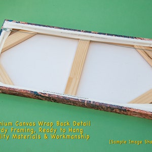 May include: Back detail of a canvas art piece, showing the wooden frame and canvas wrap. The canvas is stretched over a sturdy wooden frame, ready to hang. The edges have a textured, colorful design.