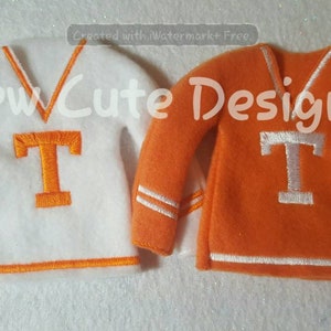 May include: Two elf-sized sweaters, one white with orange trim and a large orange "T", the other orange with white trim and a large white "T".
