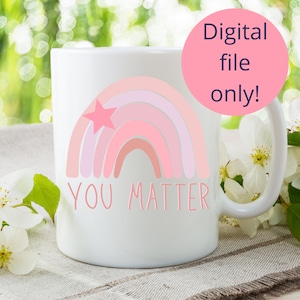 May include: White ceramic mug featuring a pink rainbow and a star design. The text "YOU MATTER" is printed below the rainbow.