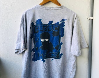 Camiseta vintage original de los años 90 con imagen pública de ropa de surf estadounidense