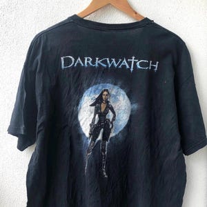 Koszulka z nadrukiem postaci z gry Darkwatch: Curse Of The West Person Shoter Vedio Game „Tala” z lat 2000. / Gry z lat 2000. / Gry wideo z lat 2000.