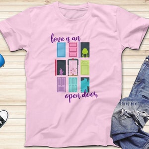 May include: Pink t-shirt with a graphic of colorful doors and the text "love is an open door".
