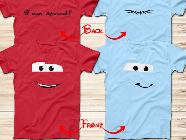 May include: Two t-shirts, one red and one light blue, with a cartoon face of Lightning McQueen from the Cars movie. The red shirt has the text "I am speed!" on the back.