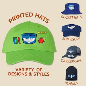May include: A variety of printed hats in different styles, including bucket hats, sun visors, trucker caps, and beanies. The hats feature a space ranger theme with the text "Space Ranger" and "Lightyear" on them.