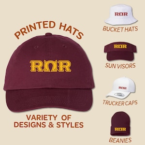 May include: A variety of printed hats with the letters "ROR" in a gold color on a maroon and white background. The hats include bucket hats, sun visors, trucker caps, and beanies.