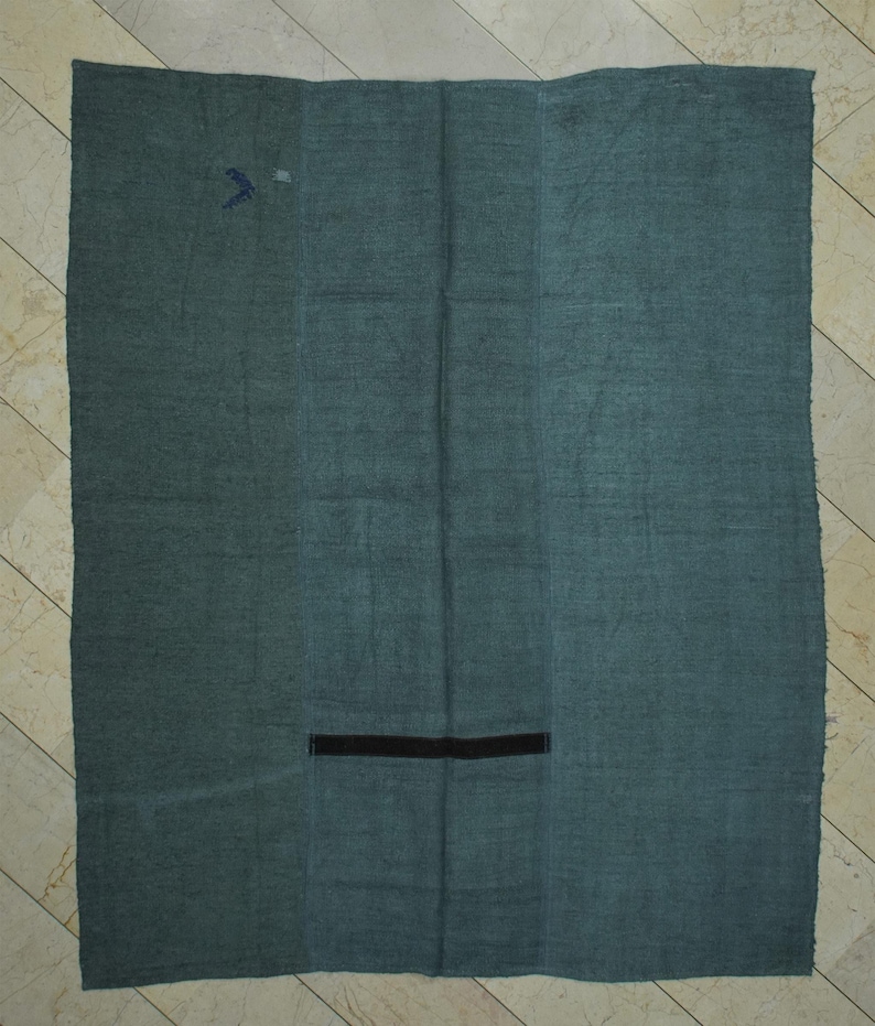 a large, rectangular piece of fabric with a black line running through the center.