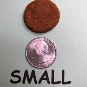 May include: A small, round, brown, cookie-like treat next to a US quarter for size comparison. The text "SMALL" is written below the objects.