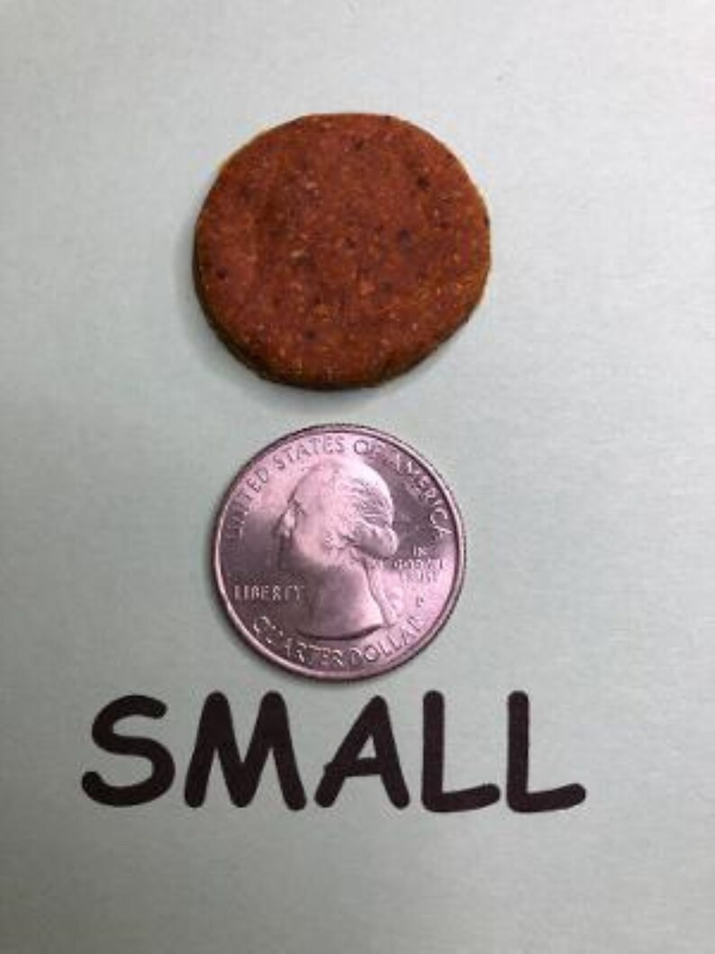 May include: A small, round, brown, cookie-like treat next to a US quarter for size comparison. The text "SMALL" is written below the objects.