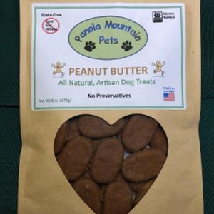 May include: A brown paper bag with a heart-shaped window showing peanut butter dog treats. The bag has a label that says "Panola Mountain Pets" and "Peanut Butter All Natural, Artisan Dog Treats".