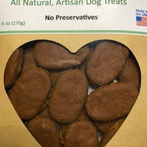 May include: A heart-shaped package of peanut butter dog treats. The treats are brown and oval-shaped. The package is labeled "Peanut Butter All Natural, Artisan Dog Treats No Preservatives 6 oz (170g) Made in the USA."