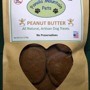 May include: A brown paper bag with a heart-shaped window showing peanut butter dog treats. The bag has a label that says "Panola Mountain Pets" and "Peanut Butter" with the text "All Natural, Artisan Dog Treats, No Preservatives".