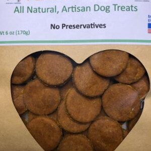 May include: A brown paper bag with a heart-shaped window showing a pile of peanut butter dog treats. The bag has the text "PEANUT BUTTER" in green letters and "All Natural, Artisan Dog Treats" in black letters. The bag also has the text "No Preservatives" and "Wt 6 oz (170g)".