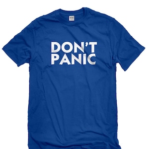 May include: A royal blue t-shirt with the words "DON'T PANIC" printed in white.