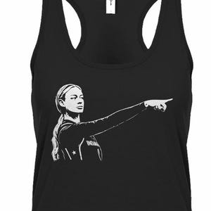 May include: A black racerback tank top featuring a white graphic print of a person with long hair tied back, wearing a long-sleeved jersey and pointing their right arm and index finger toward the right side of the garment.