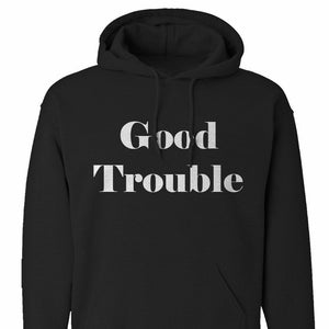 May include: Black hooded sweatshirt with the text "Good Trouble" in white lettering.
