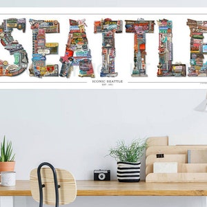 May include: A white poster with the word "SEATTLE" spelled out in large letters. Each letter is made up of smaller images of iconic Seattle landmarks, businesses, and attractions. The text "ICONIC SEATTLE EST. 1851" is printed below the word "SEATTLE".