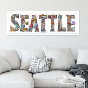 May include: A colorful collage of images forming the word "SEATTLE" with the words "SOURCE THEATRE" and "BY N.L.A." underneath.