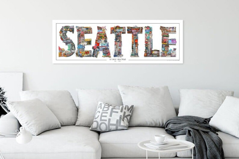 May include: A colorful collage of images forming the word "SEATTLE" with the words "SOURCE THEATRE" and "BY N.L.A." underneath.