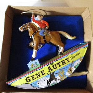 Gene Autry & Champion Wind-up Tin Toy Rocking Cowboy with Lasso Tin Toy like new in Original Box