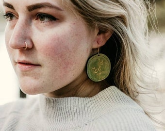 Circle shaped earrings with gold floral design - laser engraved wood with hand-painted green details and brass hooks - fall fashion, holiday
