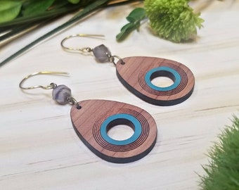 Blue teardrop shaped red cedar wood drop earrings with laser cut red cedar and white brown agate star cut bead