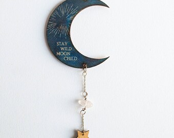 Wall hanging or mobile decoration for home of crescent moon engraved with Stay Wild, Moon Child celestial design
