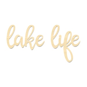 May include: Wooden sign with the words "lake life" written in a cursive font.
