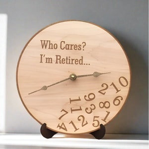 May include: A wooden clock with the text "Who Cares? I'm Retired..." and numbers 1 through 12 around the face.