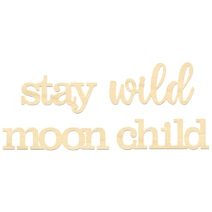 May include: Wooden cutout letters spelling "stay wild moon child" in a light brown color.