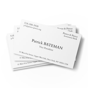May include: A stack of white business cards with black text. The top card reads "Patrick BATEMAN, Vice President" and includes contact information for "Pierce & Pierce Investment Bank" at 55 West 81st Street, New York, NY.