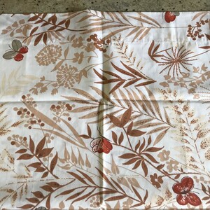 May include: A rectangular pillowcase featuring a white background with a repeating botanical print in shades of brown and tan. The pattern includes various leaves, stems, berries, and small butterflies with reddish-brown wings scattered throughout.