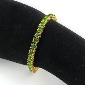 This beautiful tennis bracelet is handmade of 925 sterling silver, gold plated, and studded with prong set round cut chrome diopside gemstone. best gift for women and girls.
Chrome Diopside Bracelet
Tennis Bracelet
Handmade Bracelet
14K Gold Bracelet