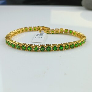 This beautiful tennis bracelet is handmade of 925 sterling silver, gold plated, and studded with prong set round cut chrome diopside gemstone. best gift for women and girls.
Chrome Diopside Bracelet
Tennis Bracelet
Handmade Bracelet
14K Gold Bracelet