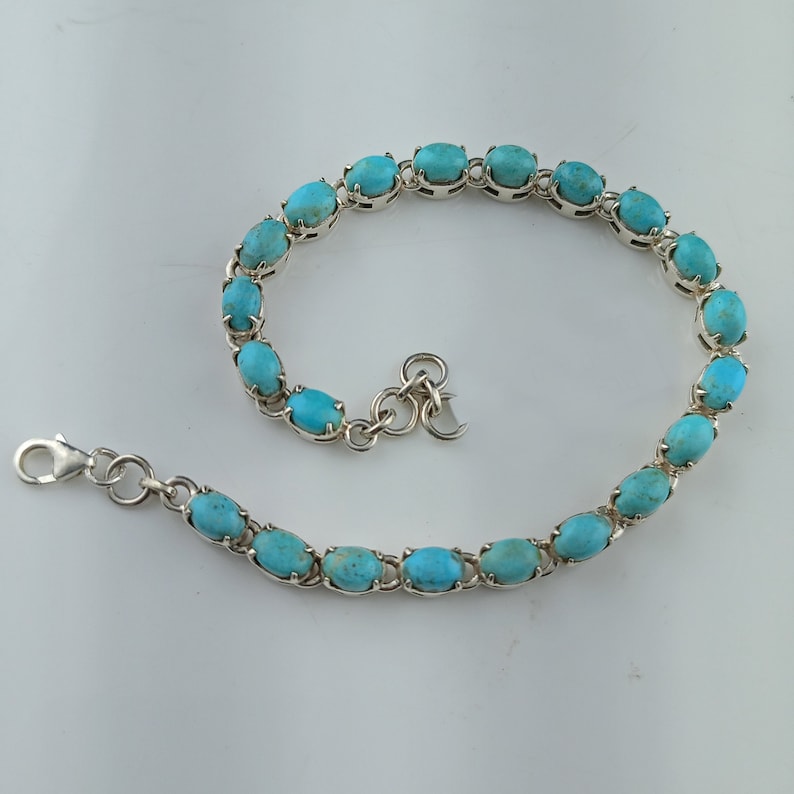 This beautiful tennis bracelet handmade of 925 sterling silver studded with prong set oval turquoise cabochon gemstone best gift for women and girls.